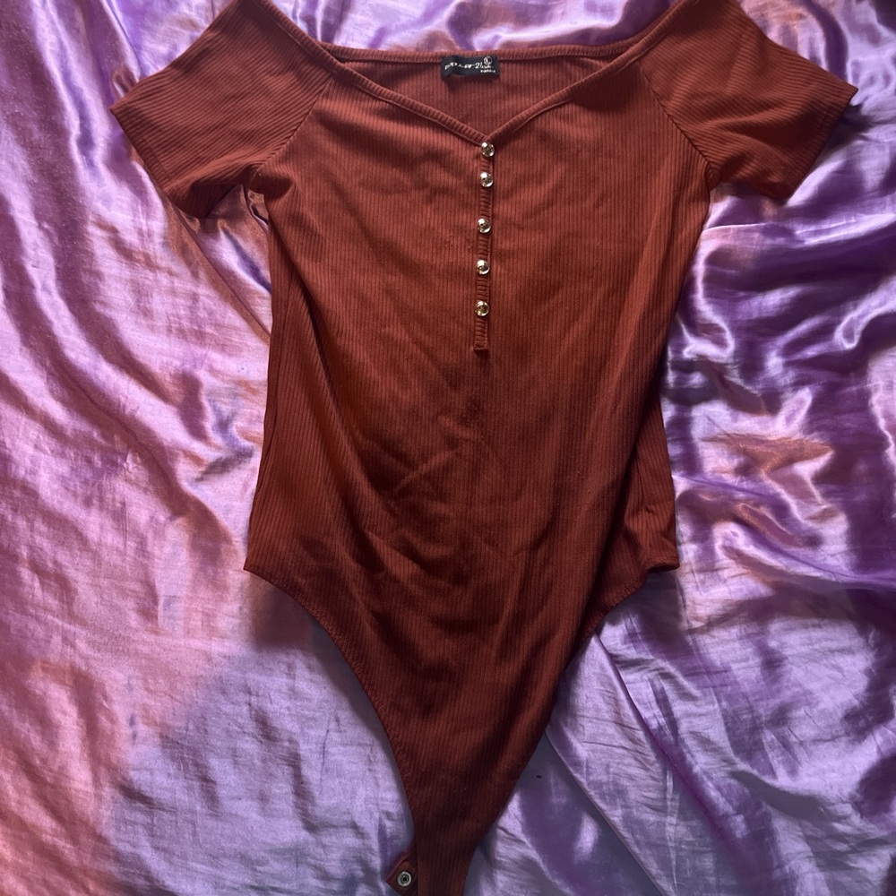 Orangish brown body suit